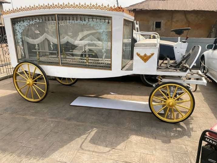 White and gold ceremonial funeral carriage